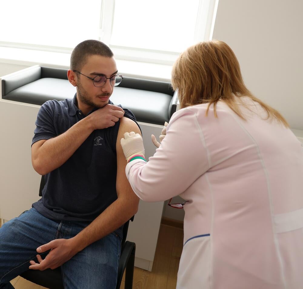 A young man getting HPV vaccination