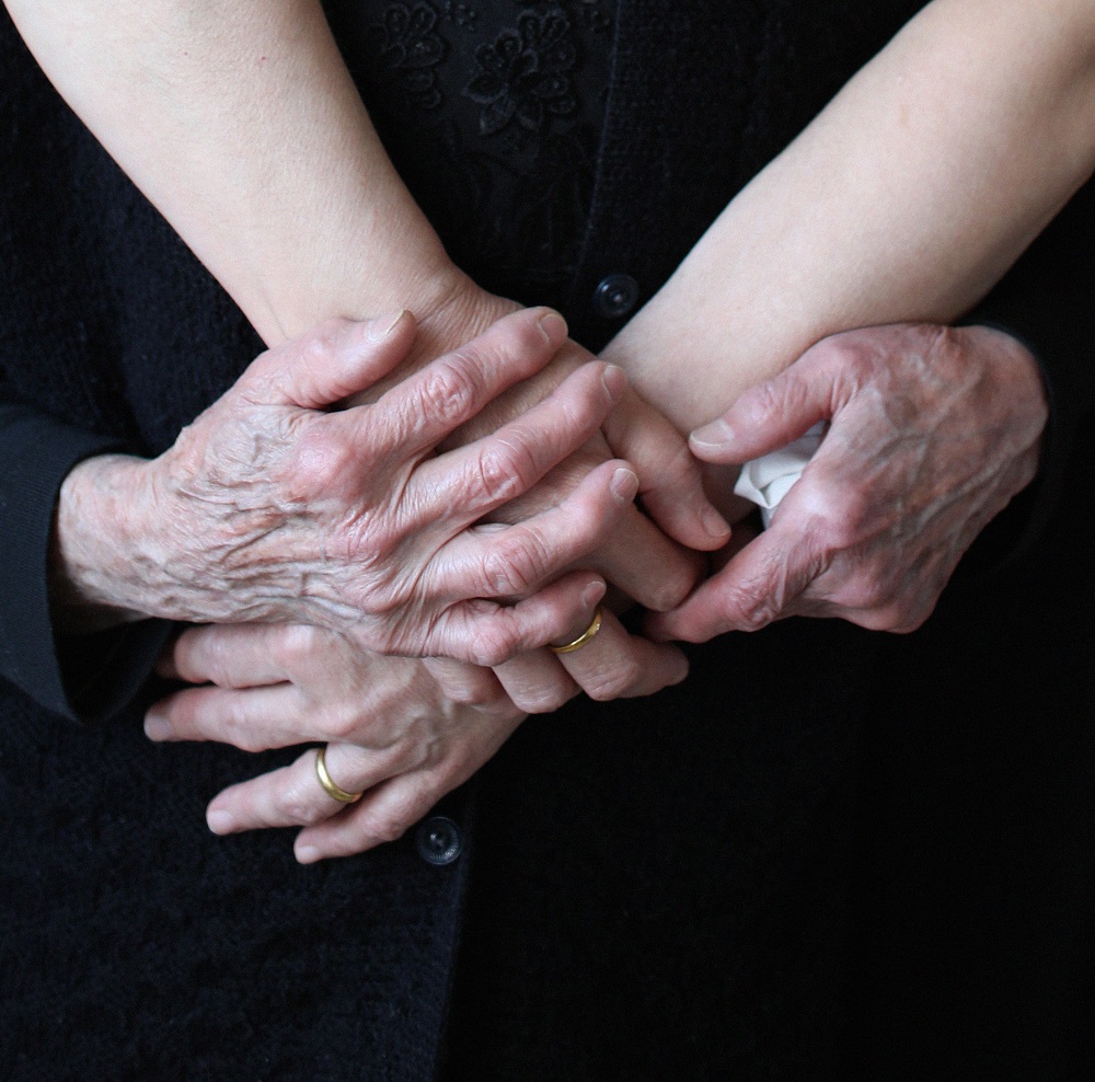 Close up to hands of two women 