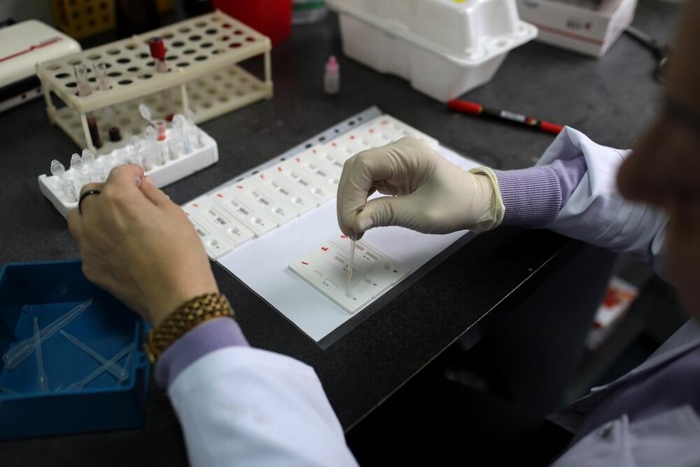 A medical personnel is making HIV testing 