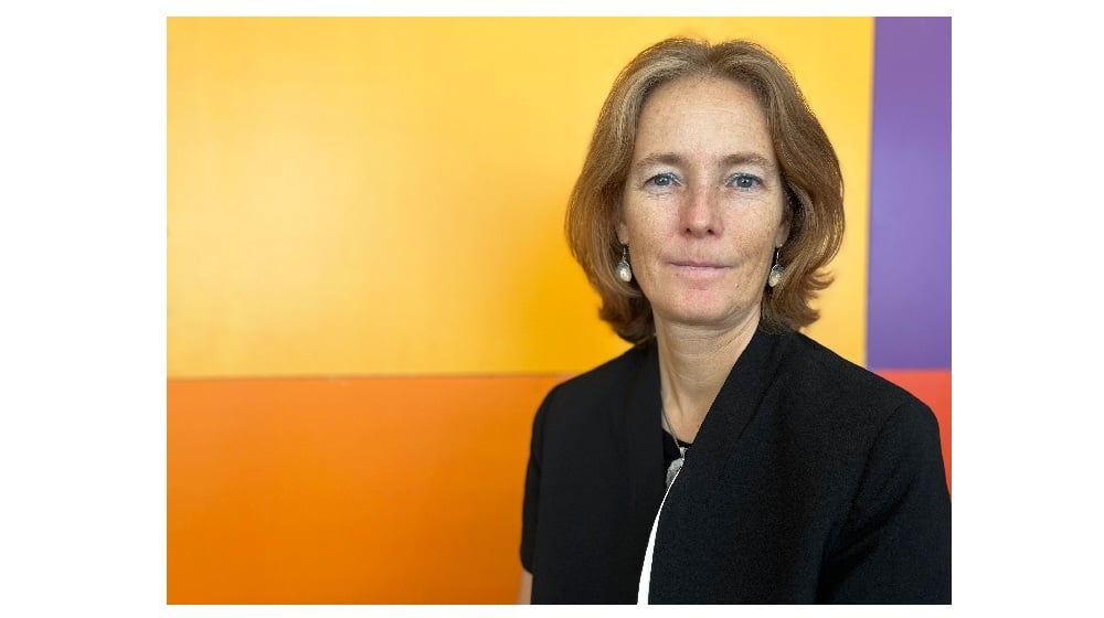 Florence Bauer - the Regional Director for Eastern Europe and Central Asia of UNFPA is standing in front of orange background