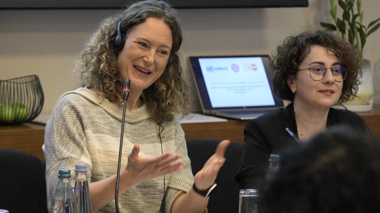 A photo of two women with curly hair