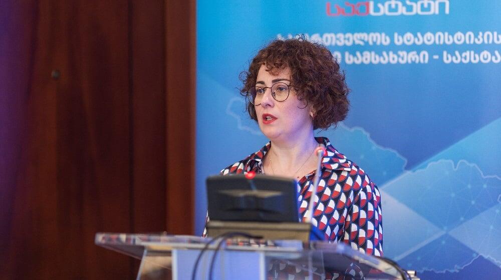 Head of UNFPA Georgia Country Office, Mariam Bandzeladze is standing at a microphone. She has short curly hair and glasses